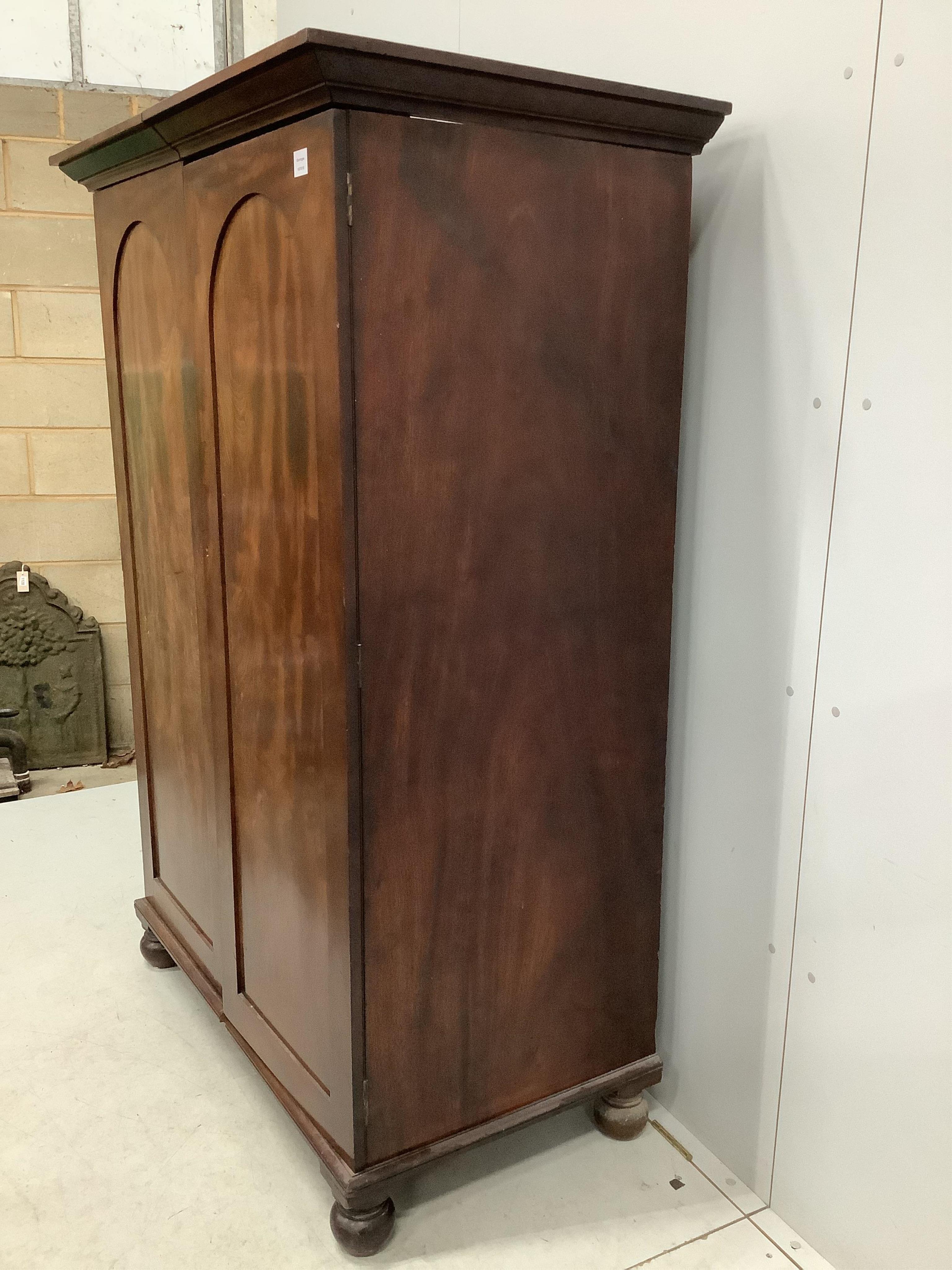 A Victorian mahogany two door hanging wardrobe, adapted, width 119cm, depth 67cm, height 175cm. Condition - poor